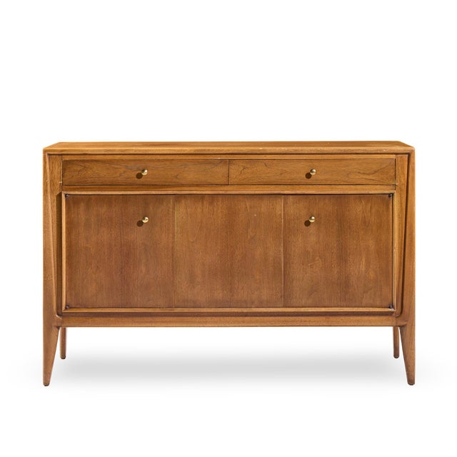 Mount Airy Facade Mid Century Walnut and Brass Credenza This credenza measures: 52 wide x 19 deep x 33.25 inches high...