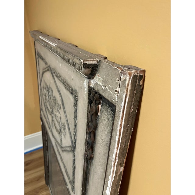 Single rectangular wood French trumeau wall mirror. Features original painted plaster finish and gilt decoration. Retains...