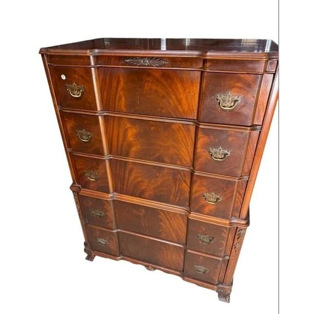 This exquisite tall chest is a refined example of Georgian and Chippendale-inspired craftsmanship. Made of solid mahogany...