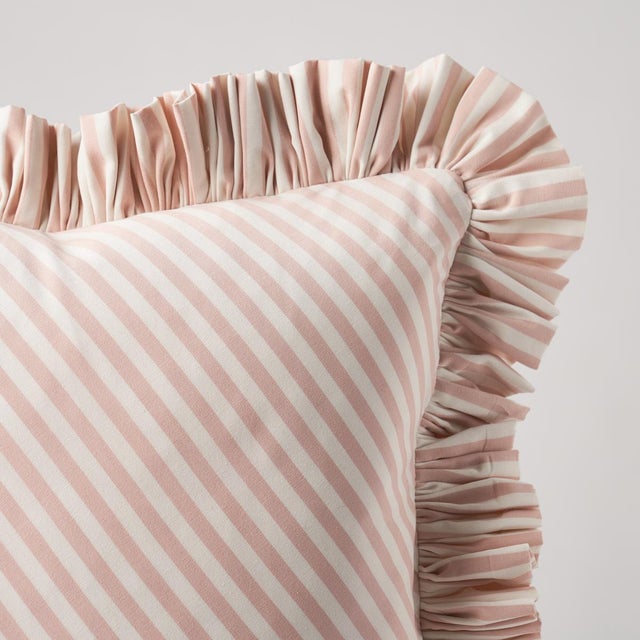 This pillow features Brigitte Stripe with a 1.5" ruffle finish. The perfect thin stripe, not too casual and not too...