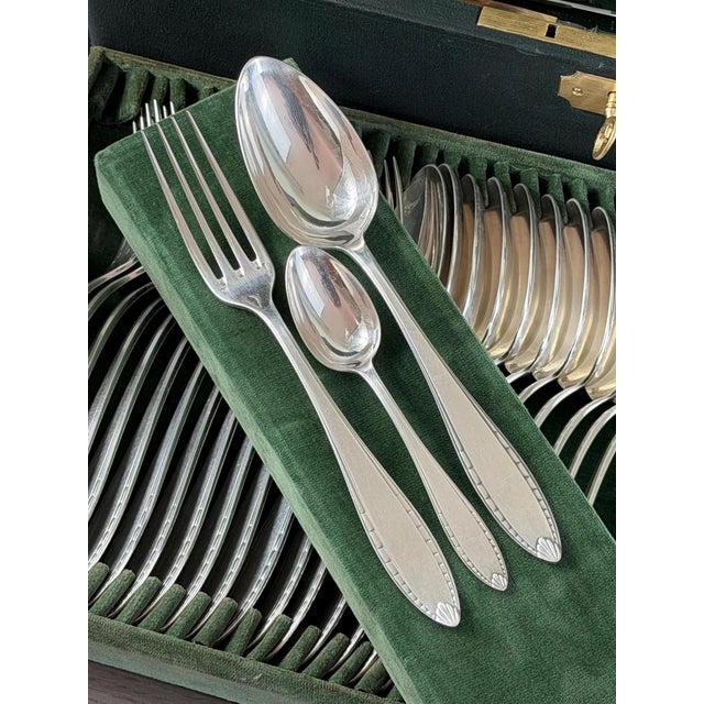 Exceptional Christofle Paris flatware set in the elegant Albatros model, produced in the 1930s and preserved in its...
