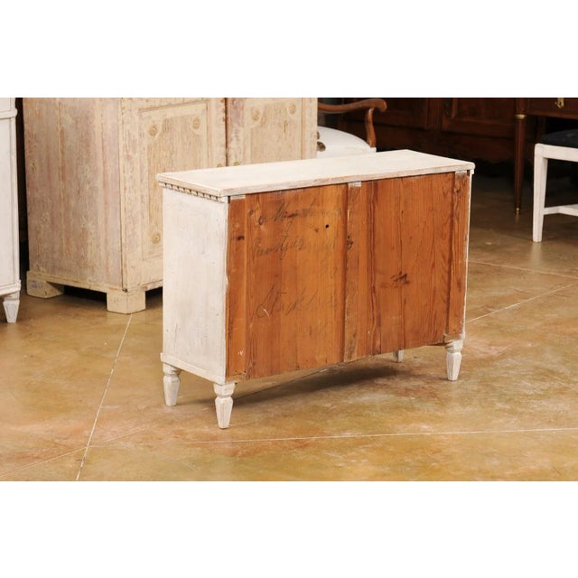 A Swedish Gustavian style painted wood apothecary chest from the late 19th century, with carved dentil molding, 10...