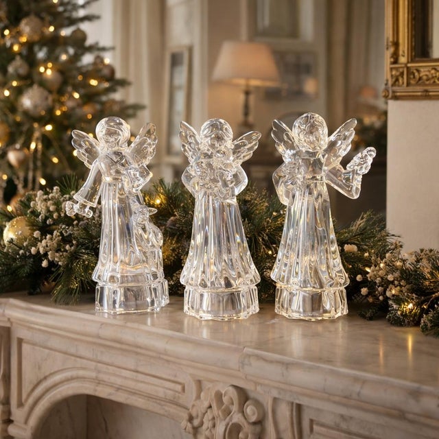 Elegant and timeless, this set of three vintage crystal angel figurines captures light beautifully with classic European...