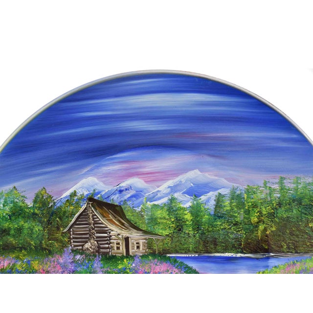 Bring the beauty of the Alaskan wilderness into your home with this stunning hand-painted metal decorative plate....