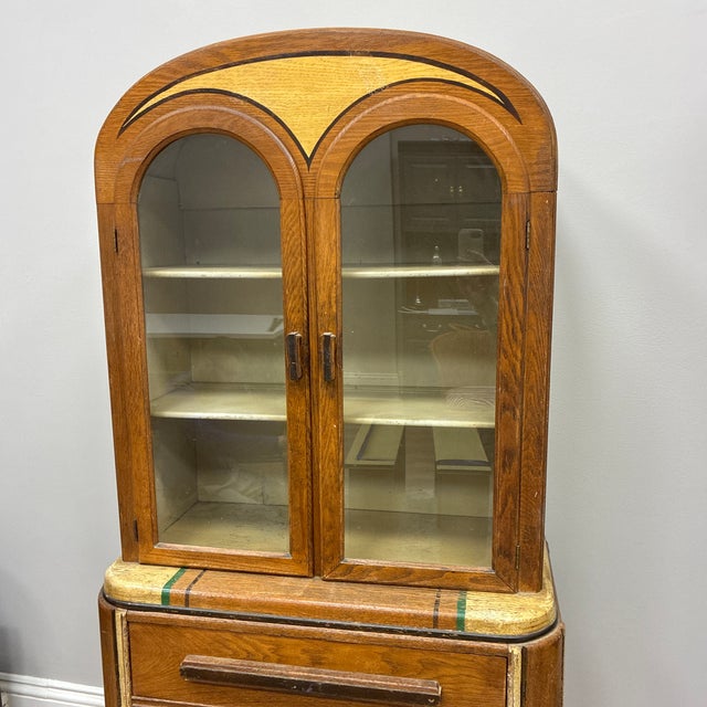 Awesome cabinet with great Art Deco details. Needs restoration to paint and finishes, but otherwise in solid condition