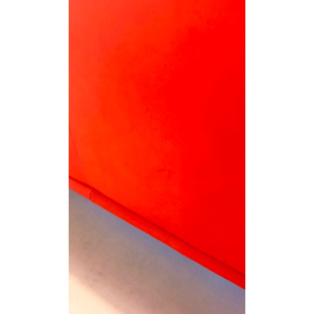 Iconic DS-2011 leather sofa by de Sede from the 1980s in a vibrant red. The characteristically curved armrests, flowing...