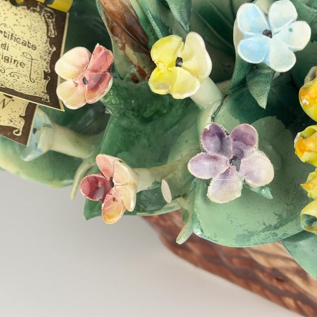 Vintage ceramic basket with flowers by Capodimonte made in Italy in the 1960s. In very good vintage condition with signs...