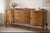 Museum-quality 1920s/30s Renaissance Revival sideboard. Featuring stunning book-matched burl walnut veneers and mahogany-...