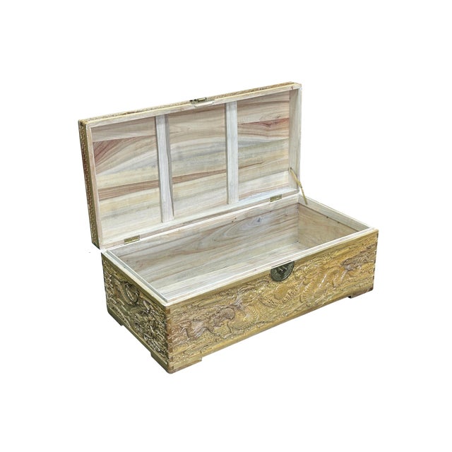 Discover the exquisite craftsmanship of this stunning hand-carved wooden treasure chest, a perfect blend of elegance and...
