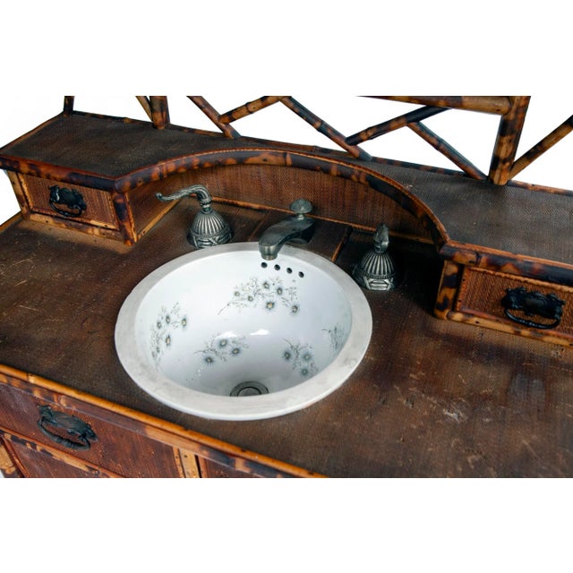Antique English Scorched Bamboo and Grasscloth Vanity Dresser with inset porcelain sink with flower design and faucet...