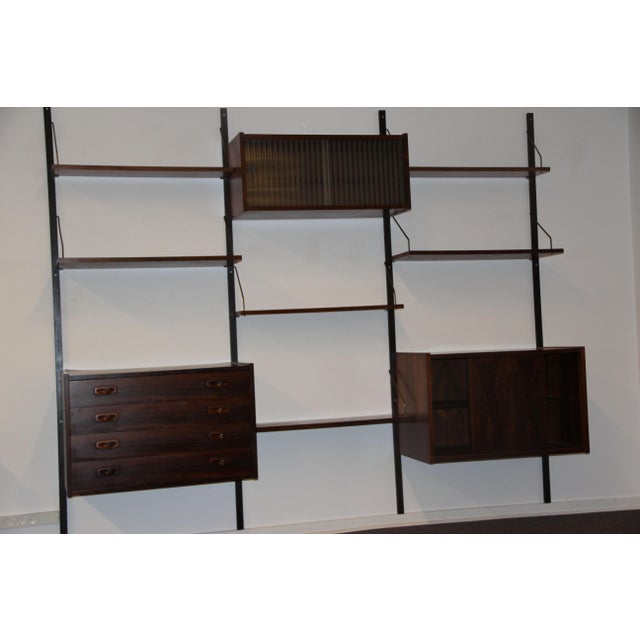 Beautiful modular wall system from PS Møbelfabrik in Randers, Denmark. In very good condition with minor signs of wear. No...