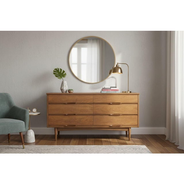 This beautifully restored mid-century modern walnut lowboy dresser showcases the timeless simplicity and clean...