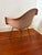 Authentic mid-century Eames fiberglass arm shell chair for Herman Miller, featuring the iconic sculptural form that...