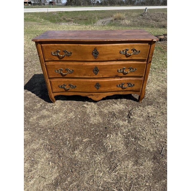 18th Century French Louis XV Commode from nice France. Made of solid Cherrywood, the wood has been finished with a...