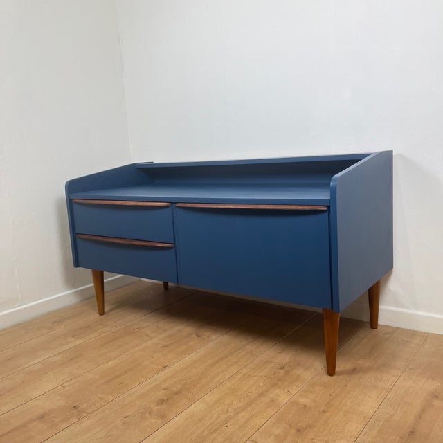 Low sideboard/TV unit in midnight blue and wood, 1960 2 drawers and a storage space with a hinged door Midnight blue color...