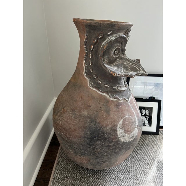 Tamarau Vessel by Iatmul Artist From Papua New Guinea. Vessel used to carry water on the heads of tribe members. We have...