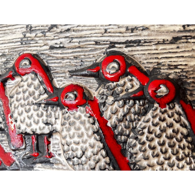 Large ceramic plaque, "The Birds," depicting a procession of stylized birds and textured surfaces with red enamel accents,...