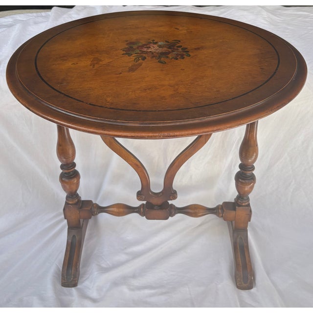 This Elizabethan style tilt top tea table is comprised of a round table top mounted onto the base with two cleats. It...