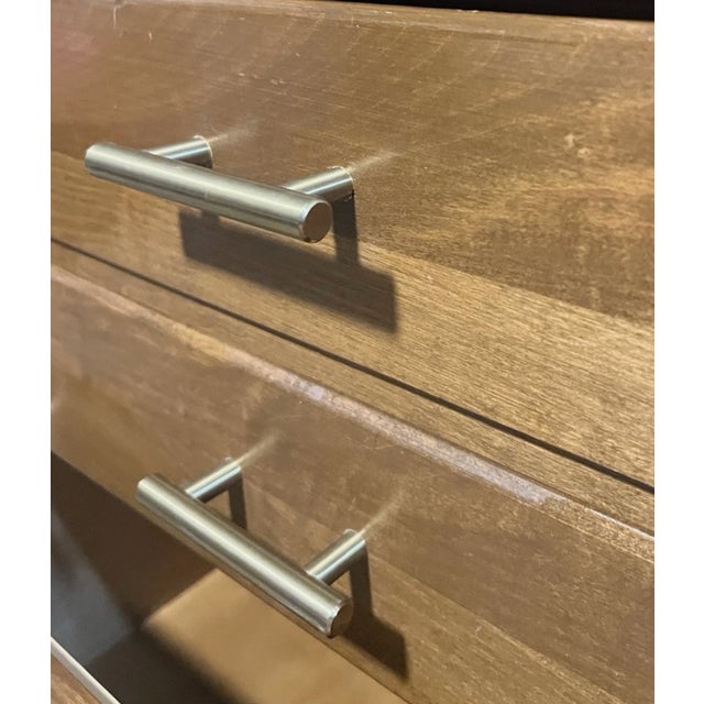 The Vintage Mid Century Modern Ethan Allen 6 Drawer Dresser in Oak Brass is a stylish and unique piece of furniture that...