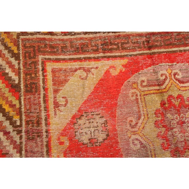 Textile Antique Khotan Traditional Red and Yellow Wool Rug With Medallion Style For Sale - Image 7 of 9