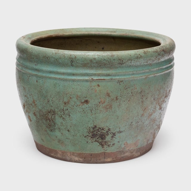 This low, ceramic planter dates to the late 19th century and was originally used as a small, tabletop fishbowl. The vessel...