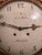 This elegant Gustavian-style wall clock features ornate giltwood craftsmanship, characterized by neoclassical motifs such...