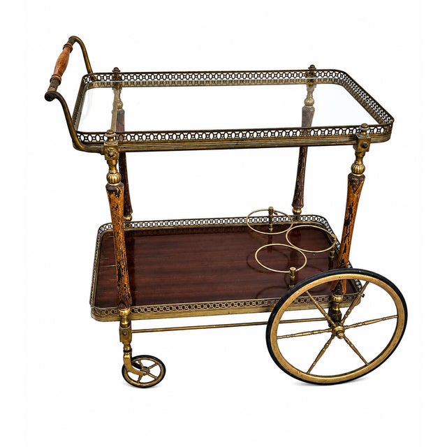 Magnificent bar cart/drinks trolley in brass and wood by Maison Jansen, France, circa 1940. Dimensions: Height 72 cm,...