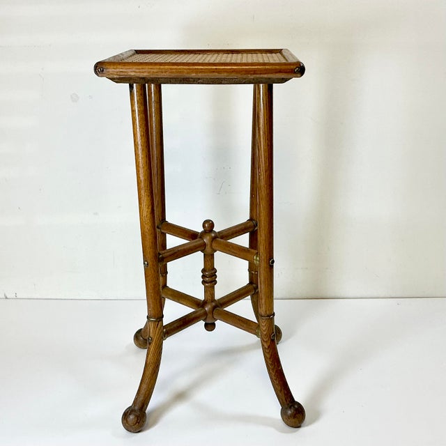 We fell in love with this Drinks Table from the 1950s. The design is amazing featuring Oak bentwood stick legs with Ball...