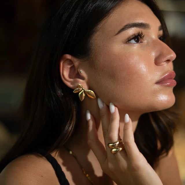 Bring nature’s elegance to your style with the Divine Leaf Dance Stud Gold Earrings. Designed to reflect the timeless...