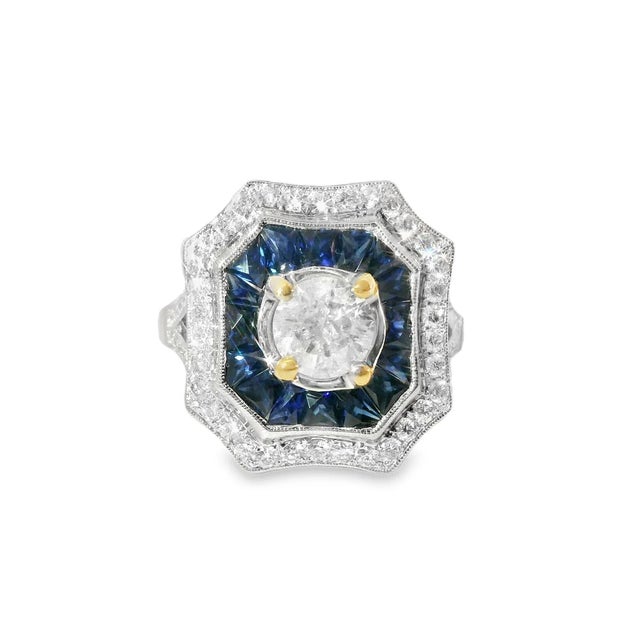 This Art Deco engagement ring is crafted in 18K white gold and features a solitaire brilliant round diamond 0.8 carats, G...