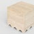 FLOW is a contemporary travertine marble side table with a clean shape and a wave detail at the bottom. The simple cube...