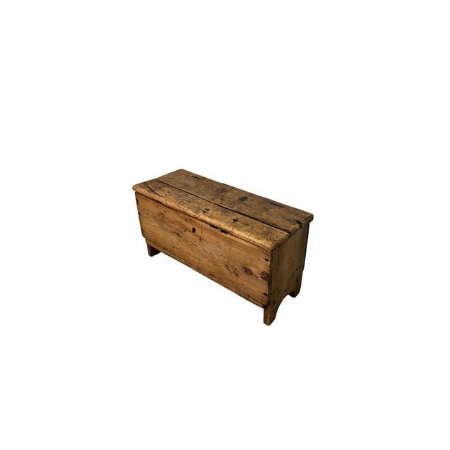 An authentic 19th-century rustic chest, crafted from solid larch wood, a typical Alpine wood, prized for its sturdiness...
