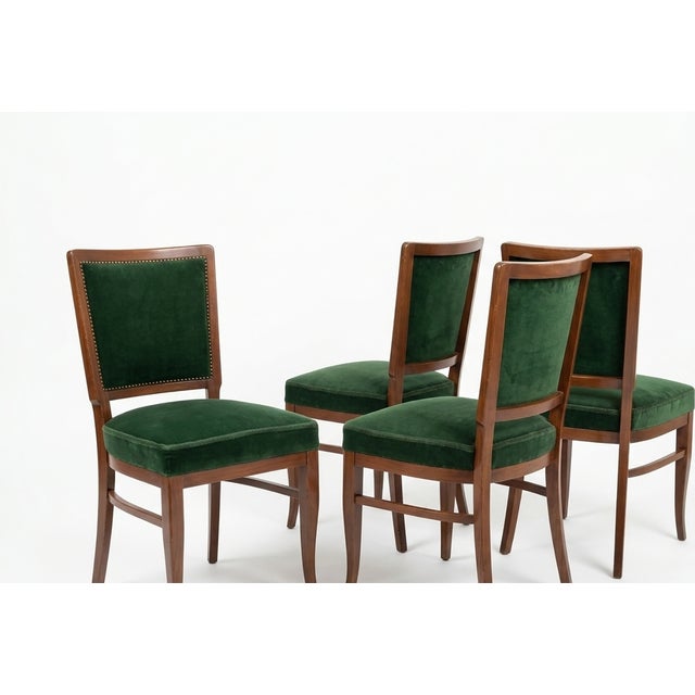 A refined set of four Biedermeier style dining chairs, masterfully crafted to embody the elegance and simplicity of the...