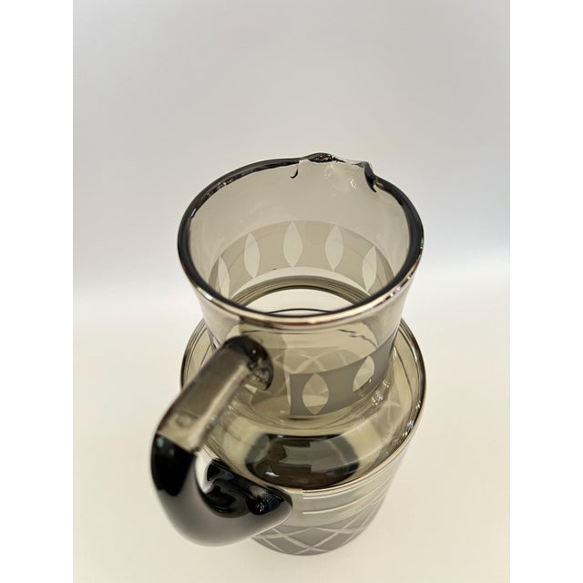Martinis, anyone? This vintage pitcher is an outstanding piece for staging a retro bar or kitchen. The smoky gray glass,...