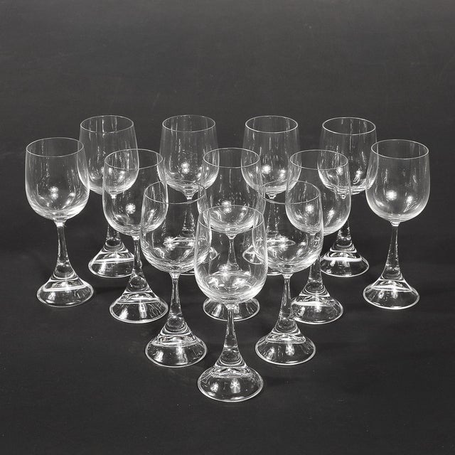 A striking set of 12 Mid-Century Modernist wine glasses, expertly crafted and signed by the esteemed German brand...