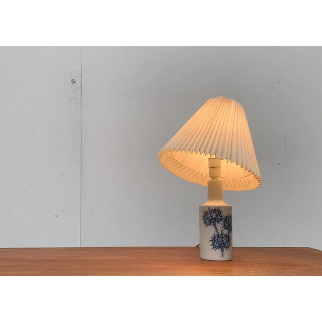 Classic table lamp from the Danish manufacturer Fog & Mørup and the renowned porcelain manufacturer Royal Copenhagen,...