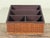 This desk organizer features a woven rattan exterior wrapped around a wood frame with a brown painted interior. The piece...