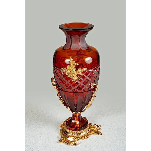 Elegantly crafted from deep amber Italian crystal, this hand-cut vase features intricate latticework and vertical fluting...