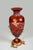 Elegantly crafted from deep amber Italian crystal, this hand-cut vase features intricate latticework and vertical fluting...