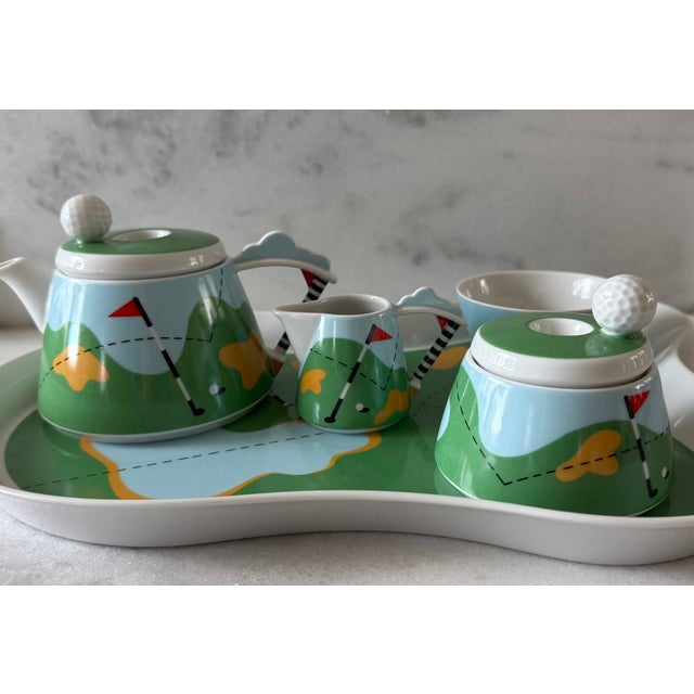 Vintage Thun Studio Karlovarsky porcelain miniature golf tea set designed by Lutoricka. Set includes 1 tray, 1 teapot, 1...