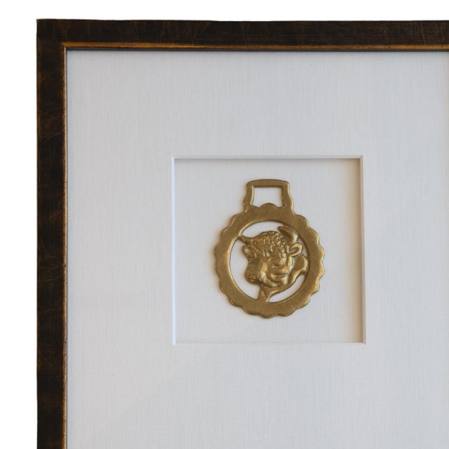 This exquisite antique horse bridle medallion, crafted in 19th century France, features a beautifully detailed bull...