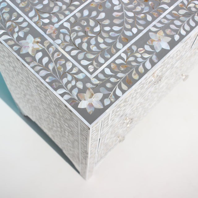 The Arabesque Seven Drawer Dresser pairs a wide, architectural silhouette with luminous Mother of Pearl inlay, set against...