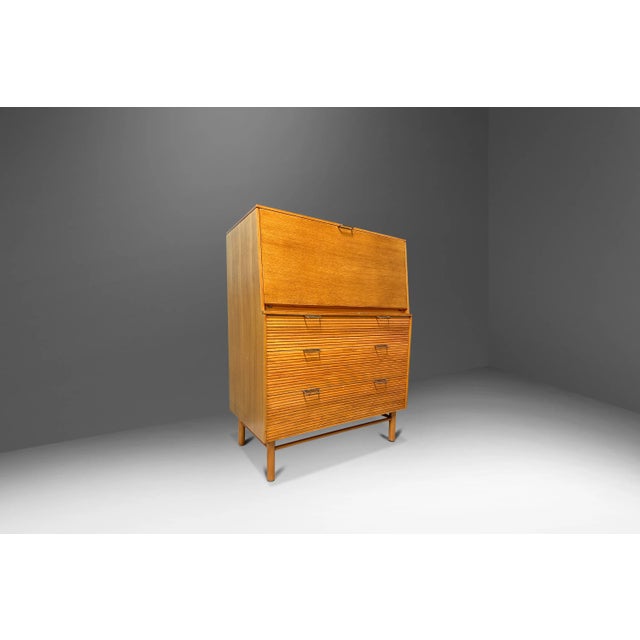 Introducing a versatile and stylish Mid-Century Modern secretary desk and chest of drawers designed by Raymond Loewy for...