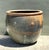 This monumental glazed ceramic planter is a tour de force of architectural garden decor, commanding attention through its...