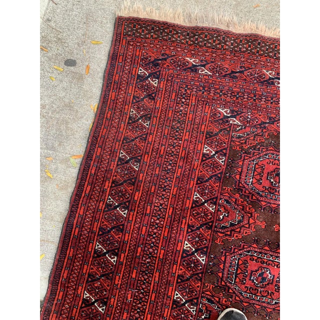 Introducing our remarkable Handmade Vintage Uzbek Bukhara Rug, a stunning piece that hails from the 1960s and encapsulates...