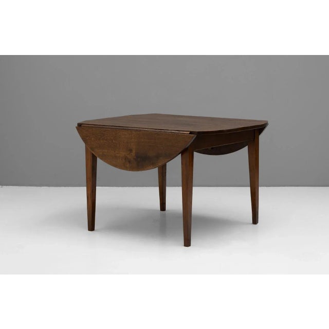 French oak drop leaf table on tapered legs. Circa 1850