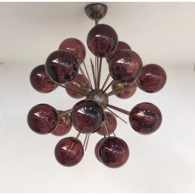 Italian sputnik chandelier with 18 amethyst Murano glass globes carefully hand blown with bubbles inside the glass using...