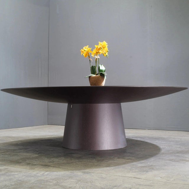 The Emmemobili UFO dining table with Embedded Lazy Susan by Ferruccio Laviani is a striking blend of futuristic design and...