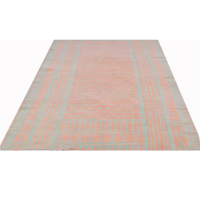 This beautiful Persian Kilim area rug features a Scandinavian design. Currently a popular modern design trend, these area...