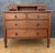 Charming chest of drawers crafted in oak, featuring a practical and elegant layout with two small upper drawers set into a...